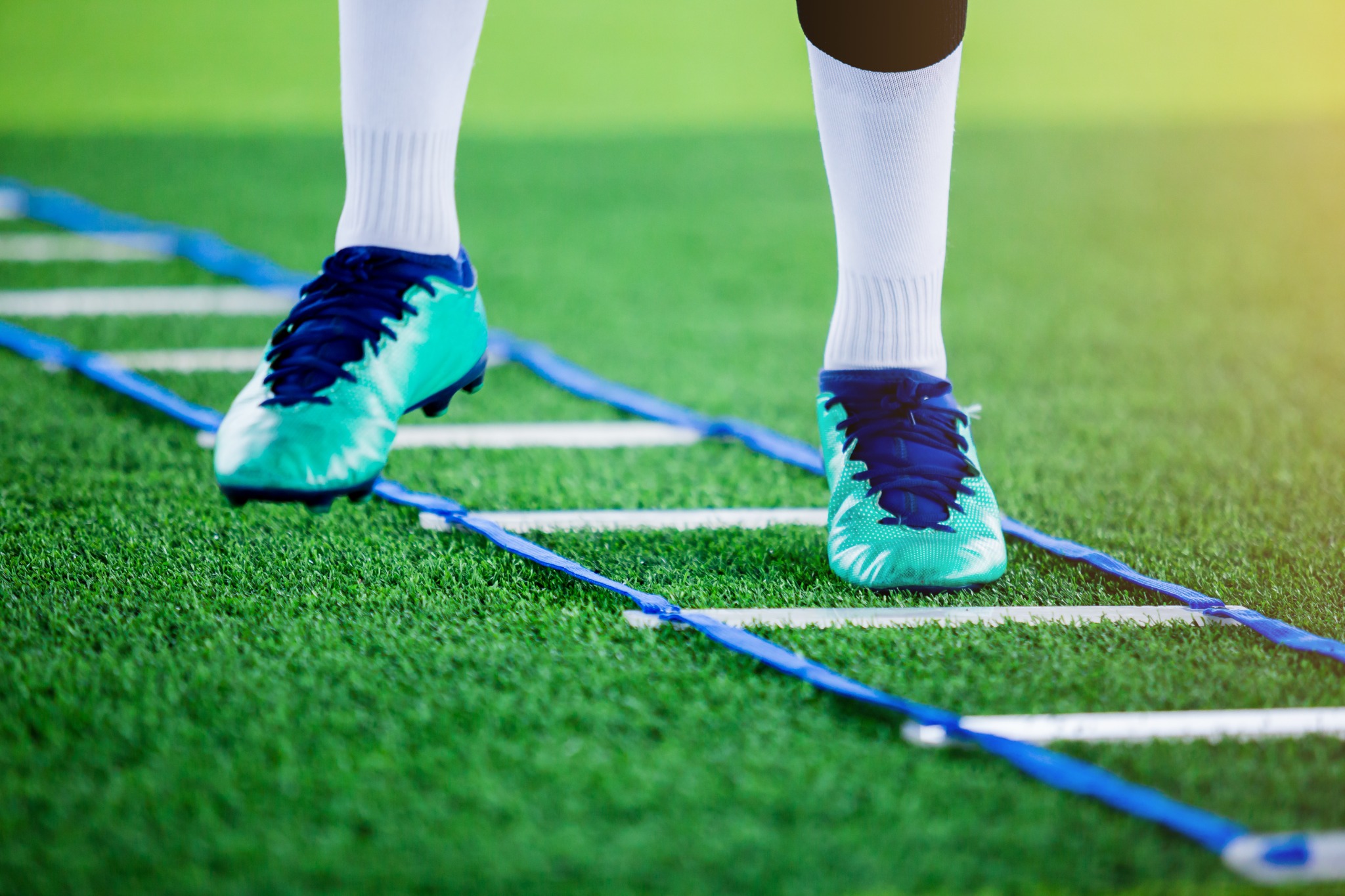 Agility ladder and cleats for soccer footwork training